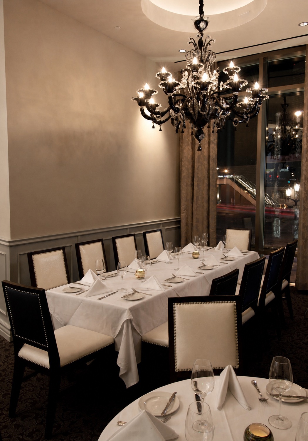 La Murrina chandelier above the private dining area at Morels Steakhouse